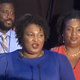 Jimmie Gardner (left) stands behind Georgia’s Democratic nominee for governor, Stacey Abrams (center), and her sister, Judge Leslie J. Abrams (right), as they celebrate Stacey’s victory May 22, 2018.
